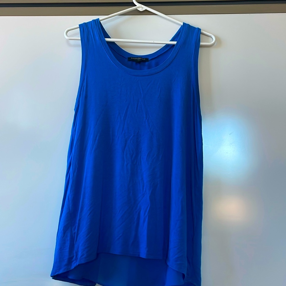Great layering piece with cute detail on back